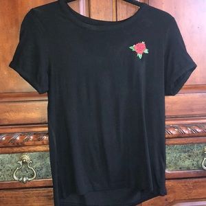Cute black shirt with a rose patch on it